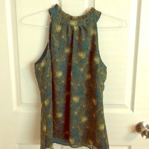 Never worn, high neck, sleeveless peacock print